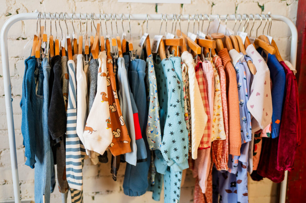 baby clothes on a rack