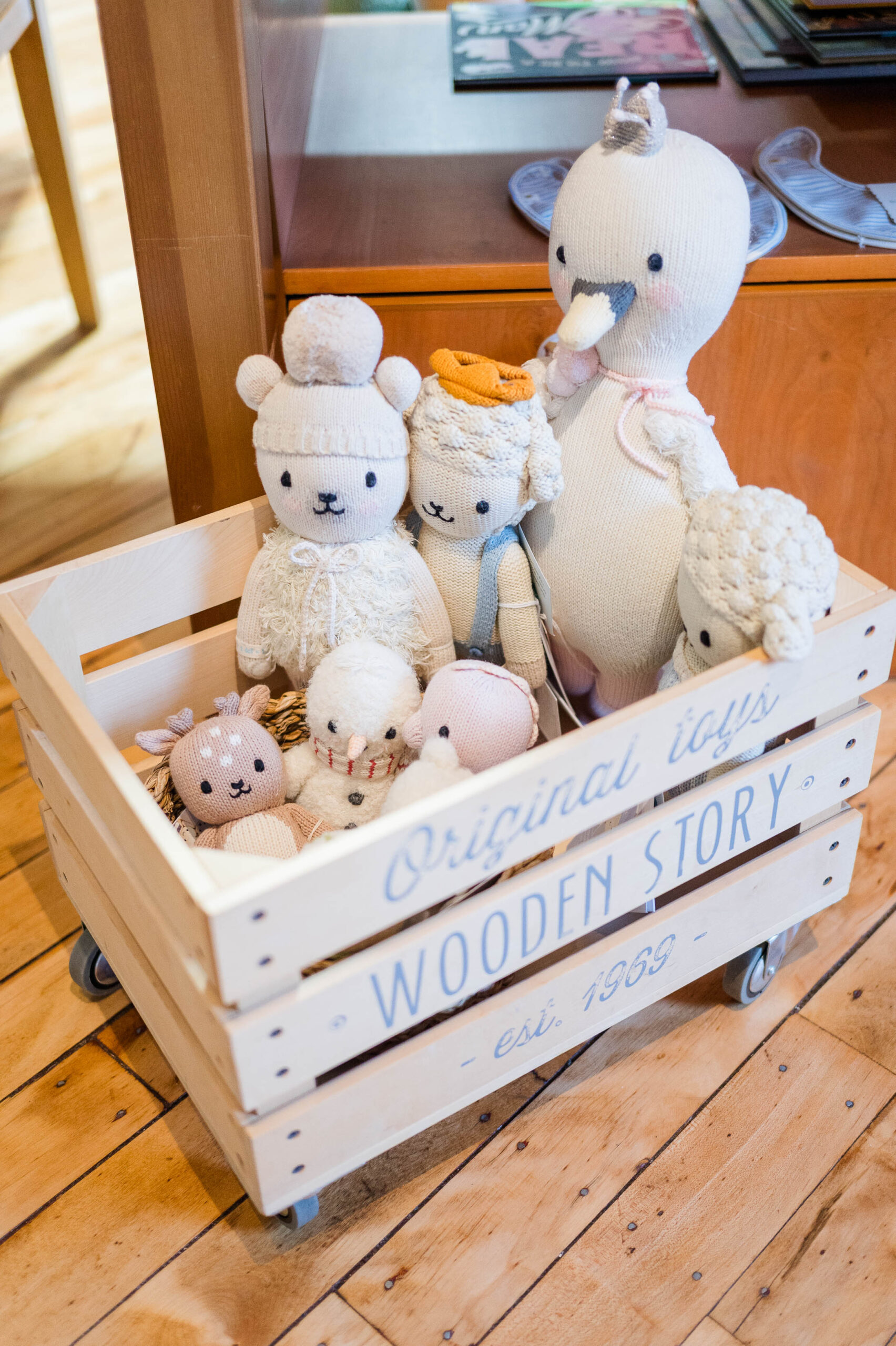 Group of cute stuffed animals in a crate
