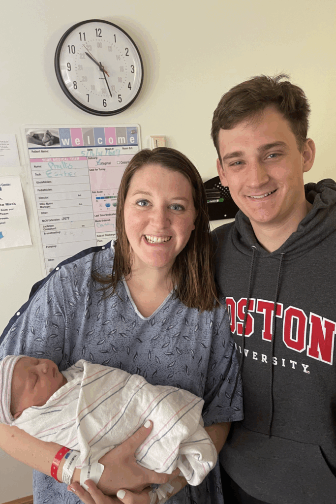 new mom and dad holding baby