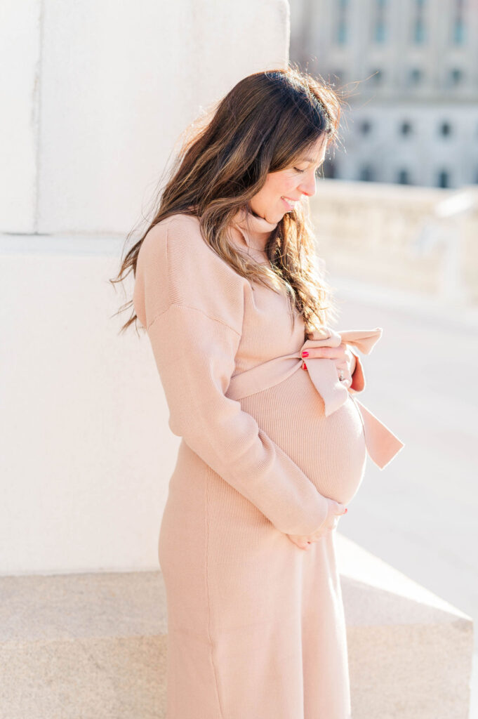 Pregnant mom looks lovingly at her bump