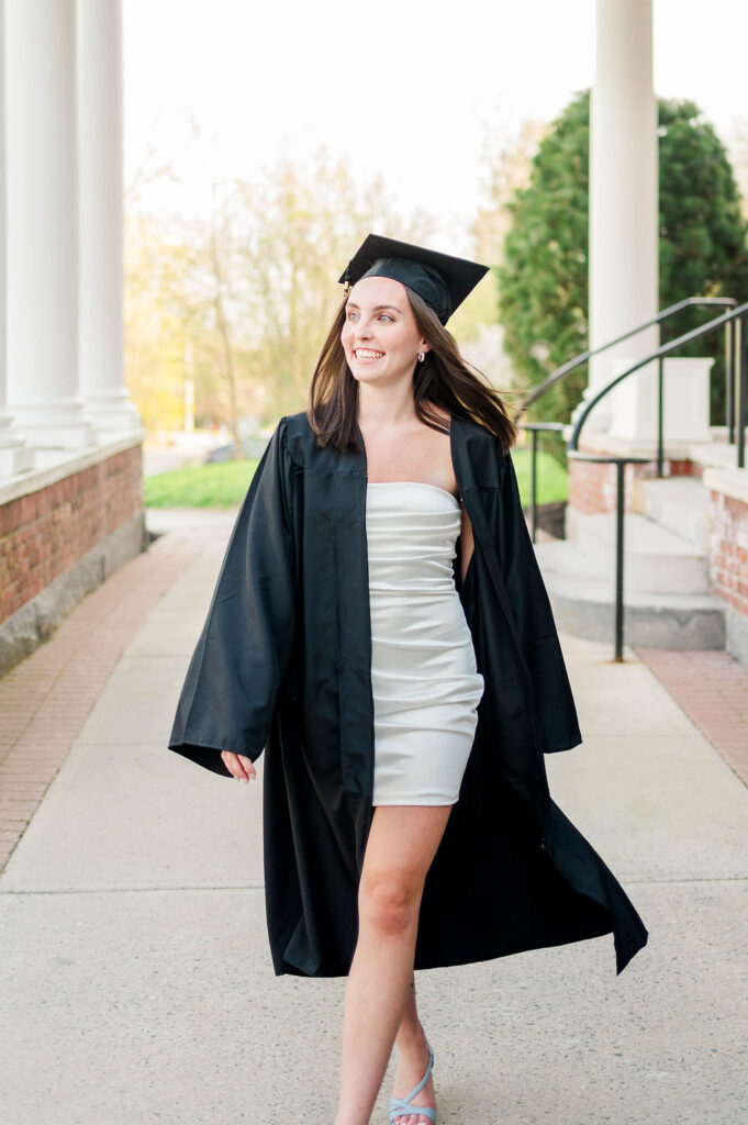 College grad walking in cap and gown