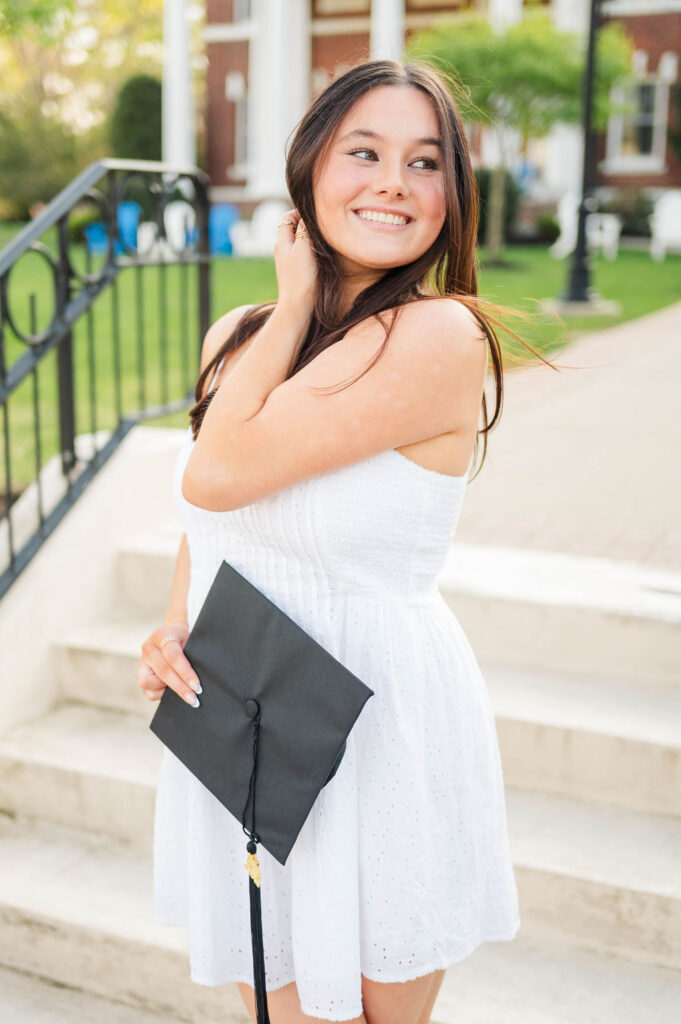 College grad at Assumption University holding her cap