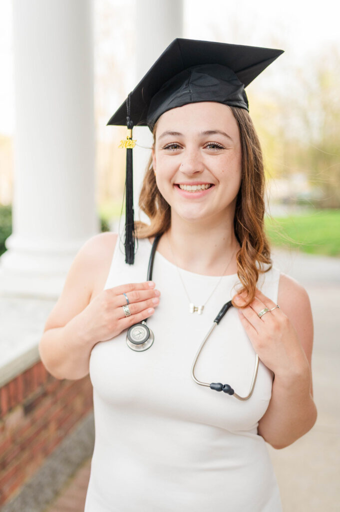 Cute college grad with cap and stethoscope