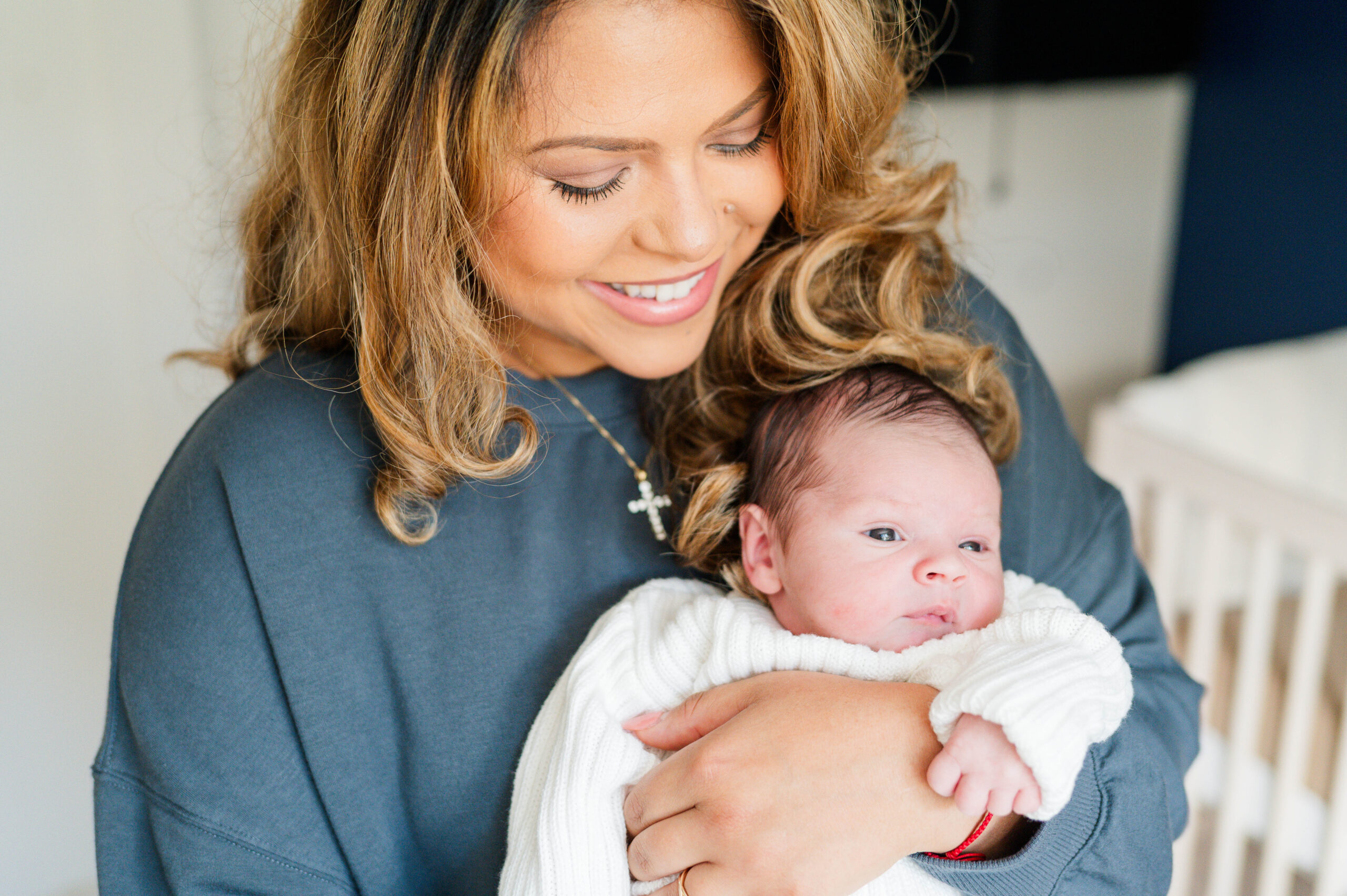 Mom smiling at newborn baby boy taken by the best Franklin, MA newborn photographer