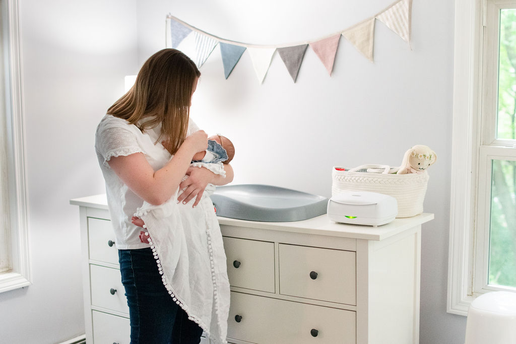 Boston nursery design simple pennant banner and mom with baby