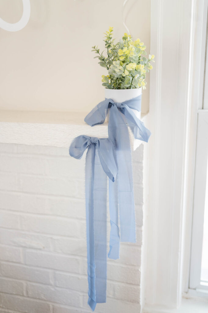 Blue ribbons on greenery