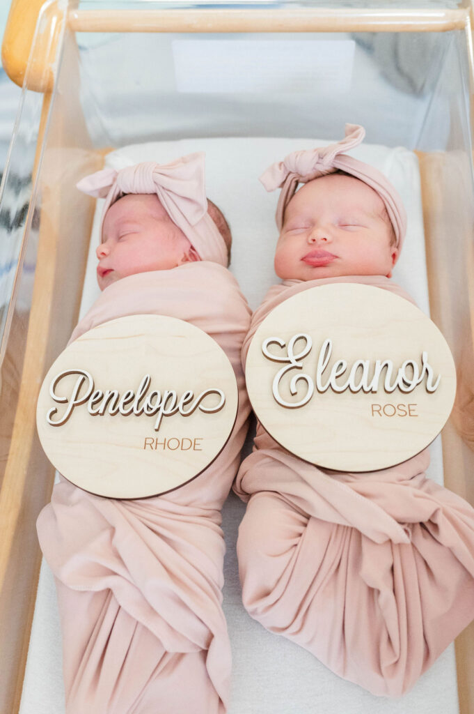 Newton Wellesley newborn photographer image of twins in bassinet