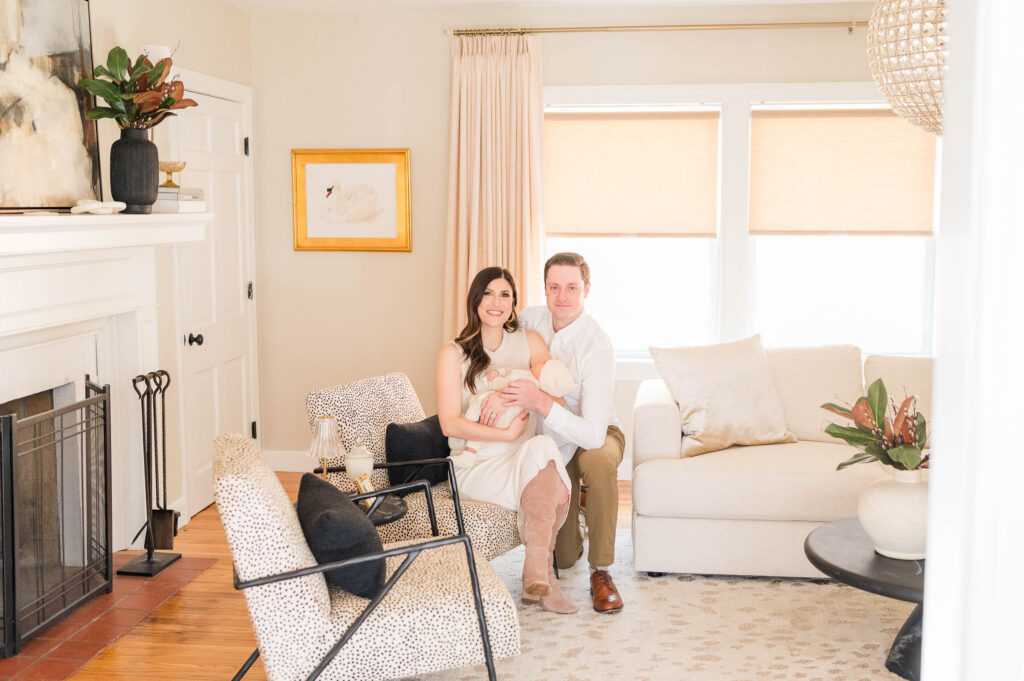 Wide shot taken by North Attleboro newborn photographer of couple with newborn baby in arms