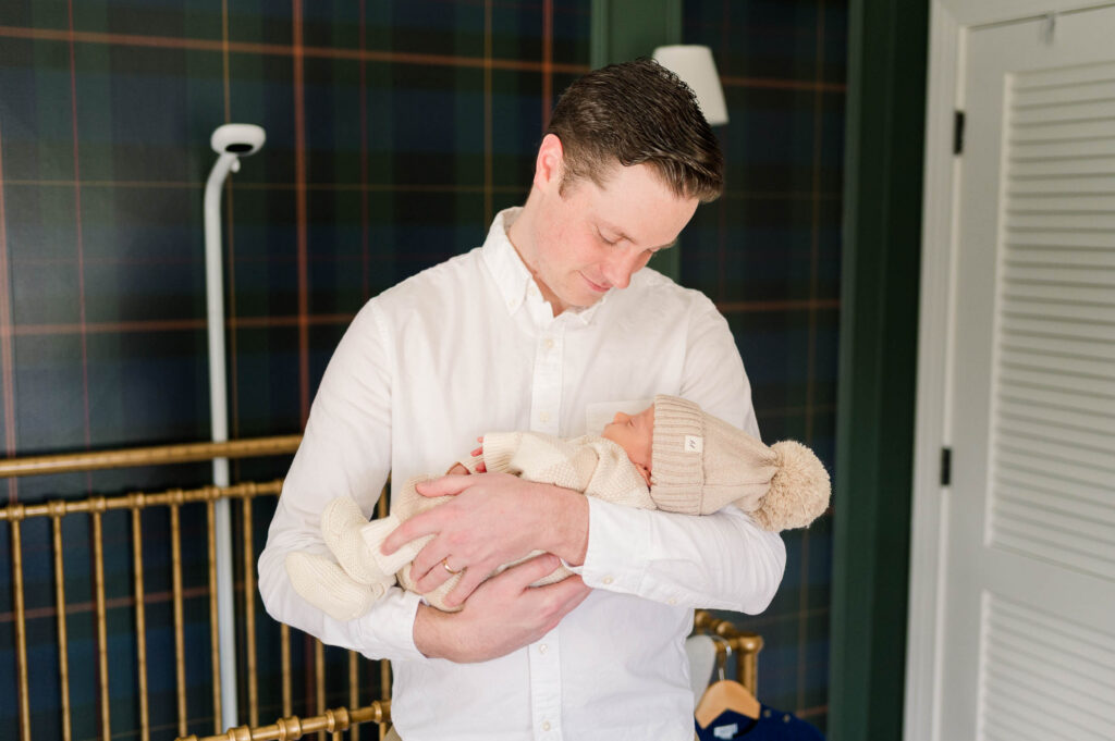 North Attleboro newborn photographer image of dad with baby in arms