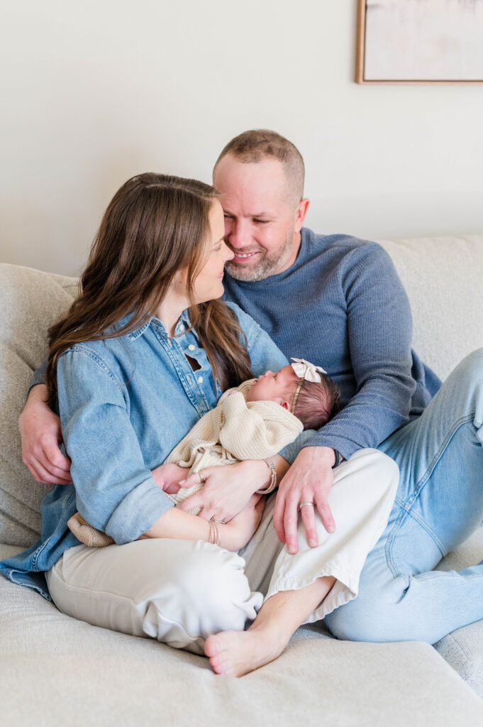 Mom and dad cozy with newborn