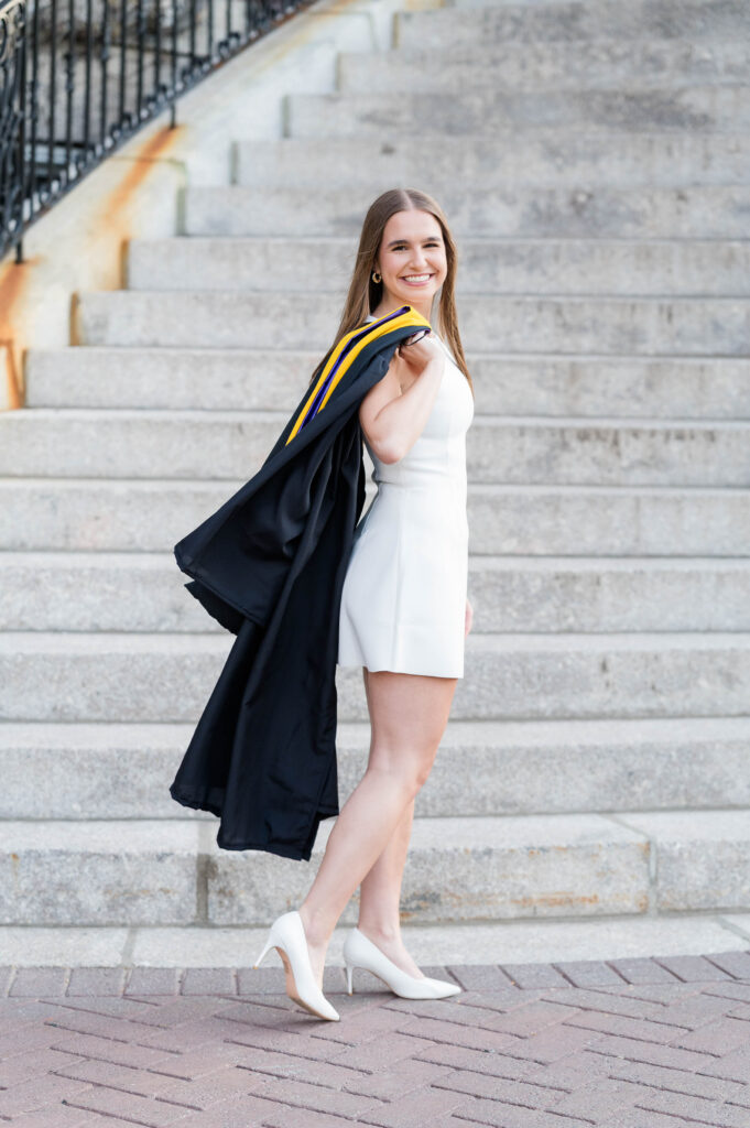 College of the Holy Cross group grad session image of happy smiling grad