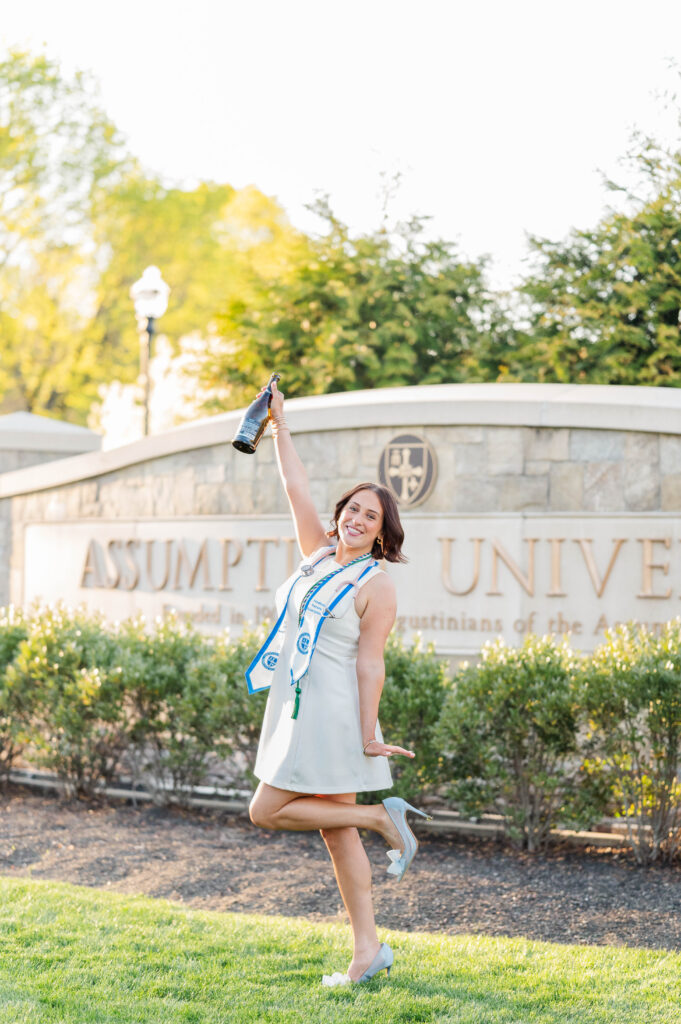 Assumption University grad celebrating with champagne