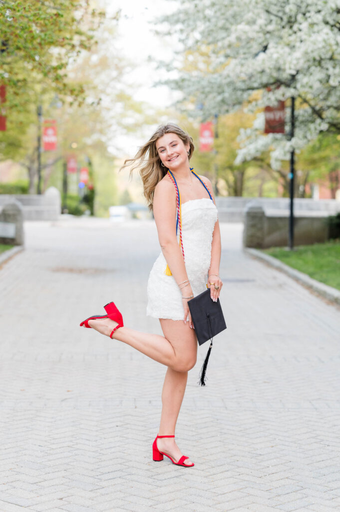 Cute WPI grad smiling and popping leg