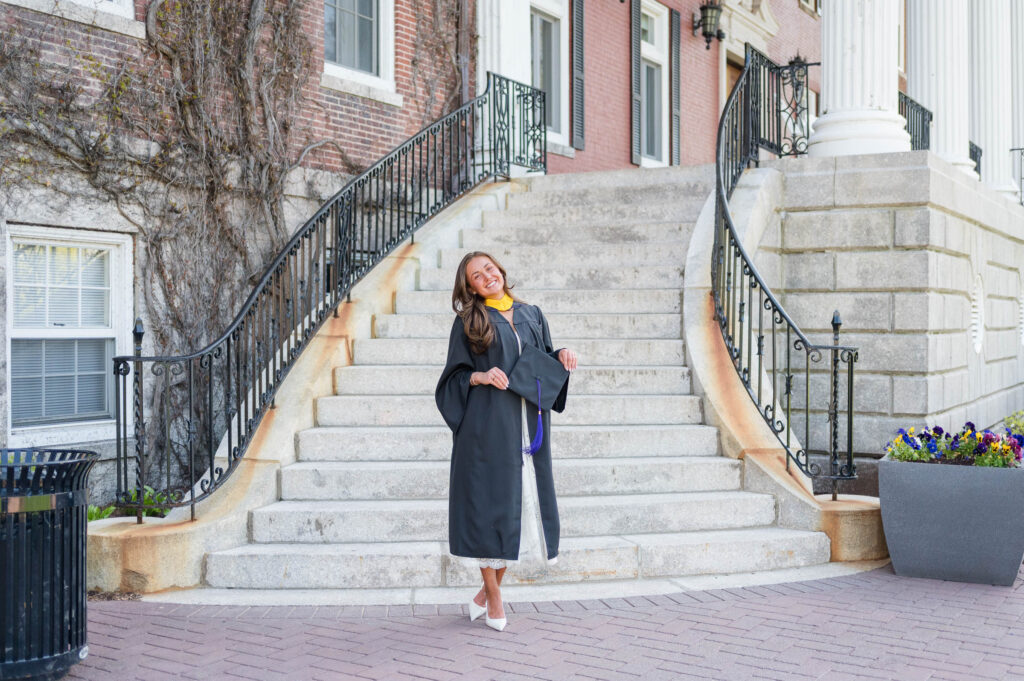 College of the Holy Cross Grad photo of grad by stairs