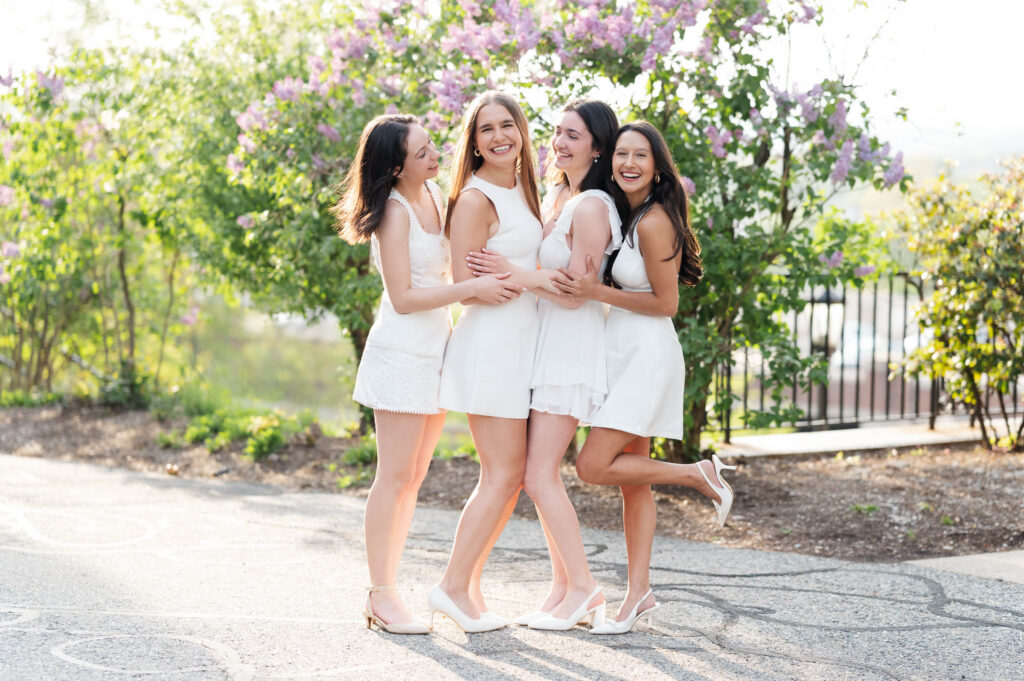 College of the holy cross group grad photography of girls laughing at each other