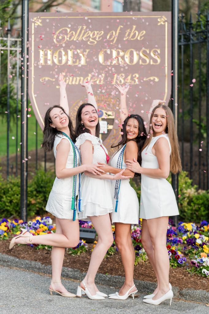 Confetti celebrating group of grads at College of the Holy Cross