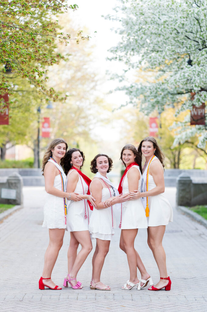 Women's basketball players at WPI grad session image of them all smiling
