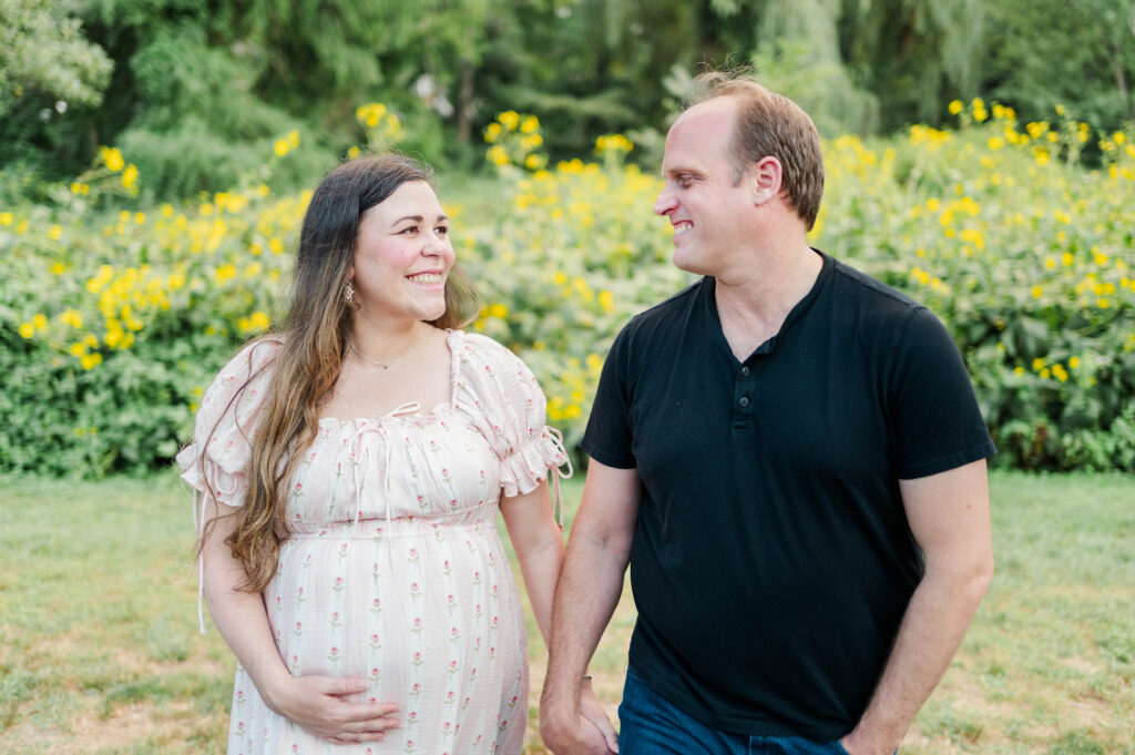 Husband and wife smiling at each other at the Arnold Arboretum